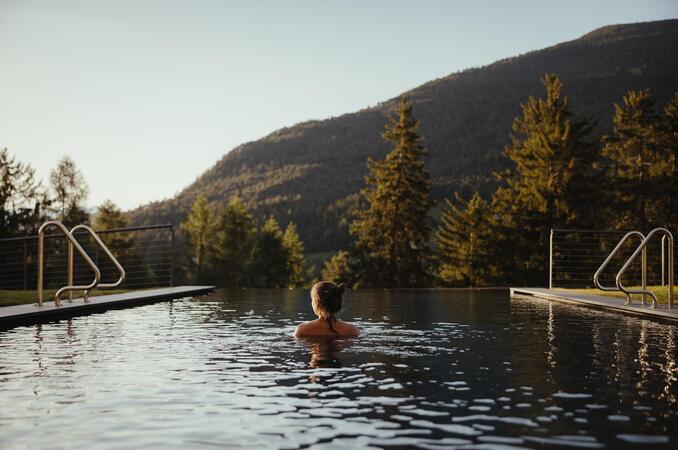 A woman in the pool at Hotel Digon