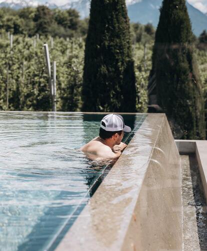 A man in the outdoor pool