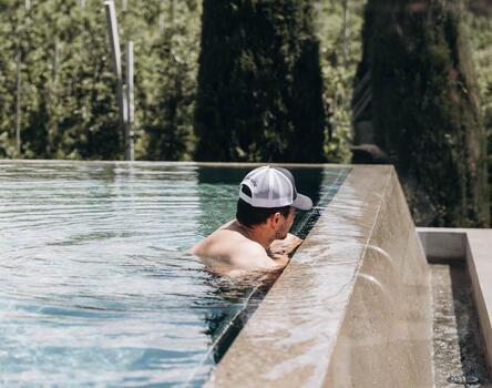 A man in the outdoor pool