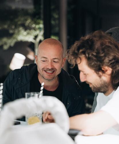 Two men are sitting at a table