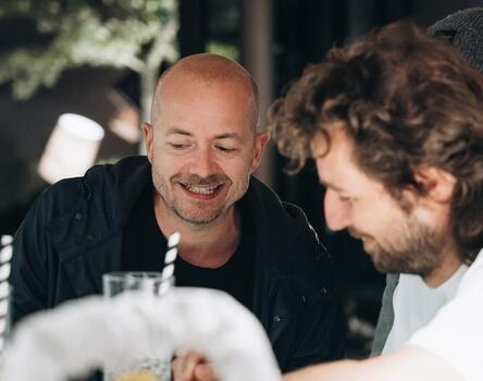 Two men are sitting at a table